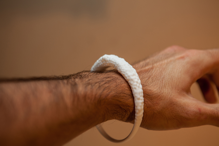 Officina-Corpuscoli-Infected-Jewellery-white-bracelet-on-hand